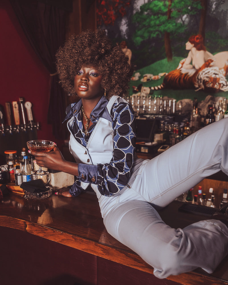High-rise bell bottom jeans styled with a waistcoat, 70s inspired outfit by Soul Sister since 1969