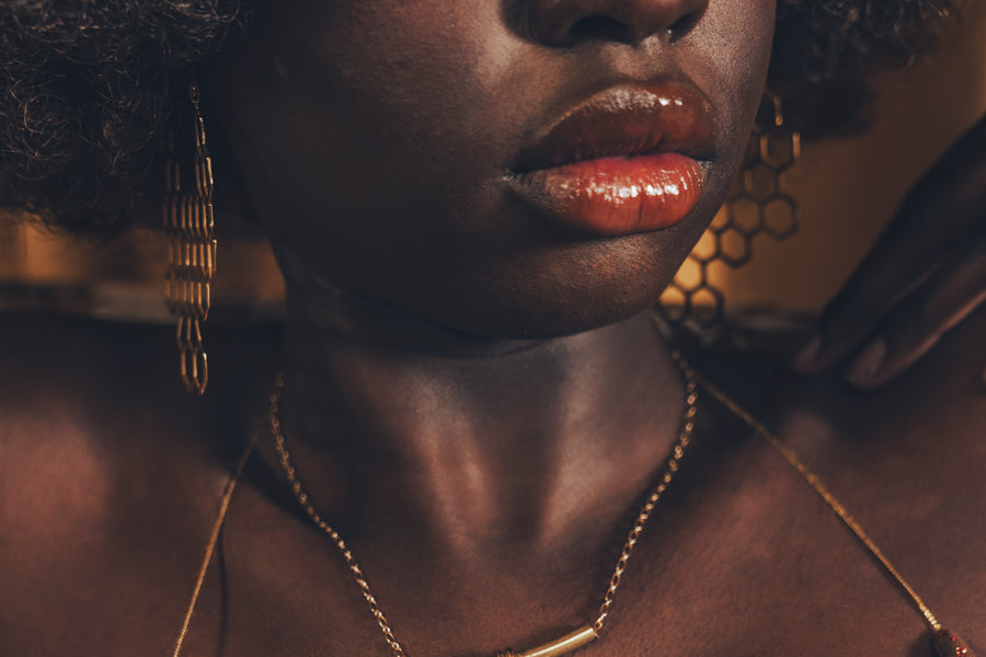 Beautiful black womandn wears sexy gold earrings for soul sister since 1969
