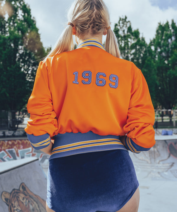 Soul Sister since 1969 orange retro bomber jacket on beauty blonde babe