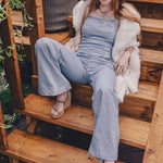 70s inspired women's denim jumpsuit with retro silhouette long flared legs and handmade details for festival and every day wear