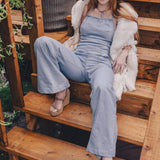 70s inspired women's denim jumpsuit with retro silhouette long flared legs and handmade details for festival and every day wear
