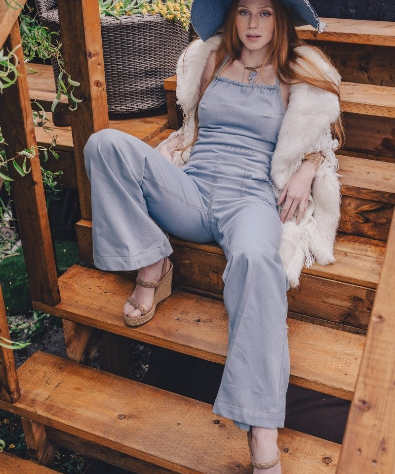 70s inspired women's denim jumpsuit with retro silhouette long flared legs and handmade details for festival and every day wear