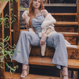  retro 1970s faded denim jumpsuit with a curved hugging fit and wide bellbottoms styled for soul sister since 1969