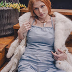  Front view of a vintage style denim jumpsuit with flared legs and curve hugging fit styled for modern retro fashion by sore sister since 1969