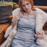  Front view of a vintage style denim jumpsuit with flared legs and curve hugging fit styled for modern retro fashion by sore sister since 1969