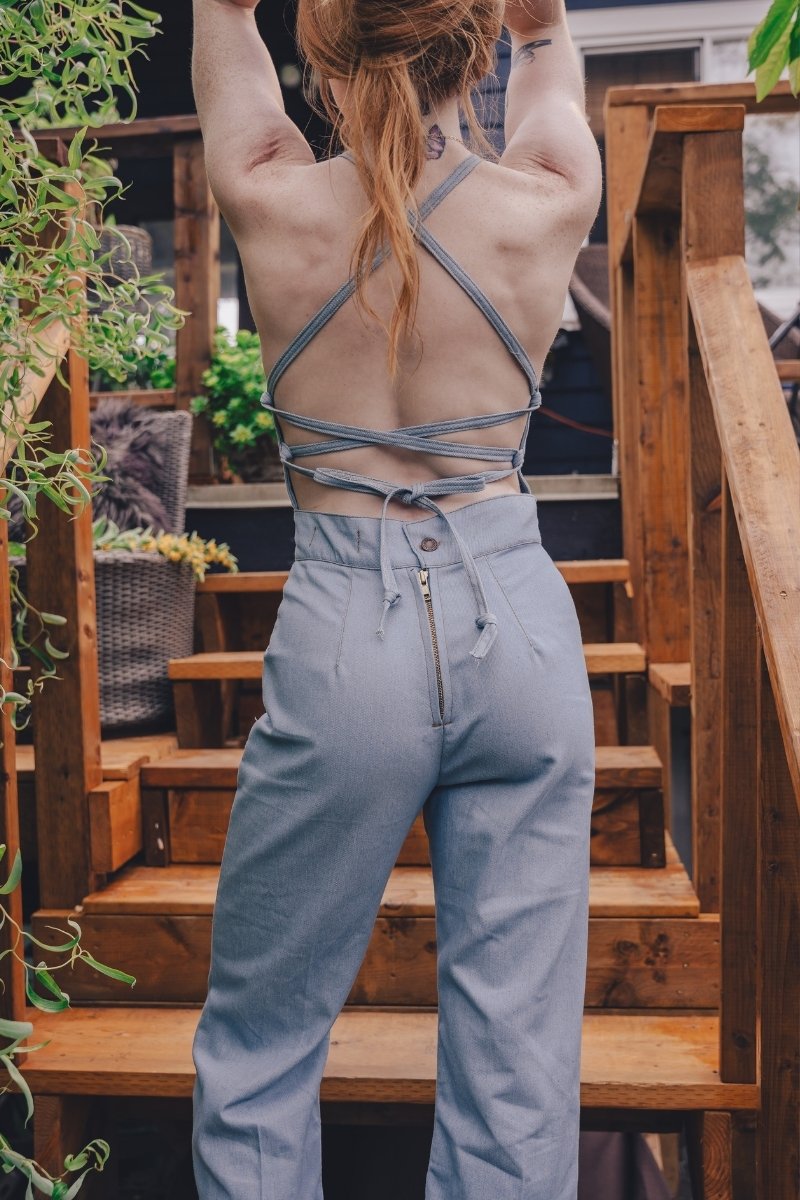  retro 1970s style denim jumpsuit with curved hugging fit and wide flare styled for soulful modern women's fashion