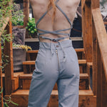  retro 1970s style denim jumpsuit with curved hugging fit and wide flare styled for soulful modern women's fashion