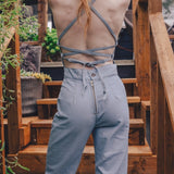  retro 1970s style denim jumpsuit with curved hugging fit and wide flare styled for soulful modern women's fashion