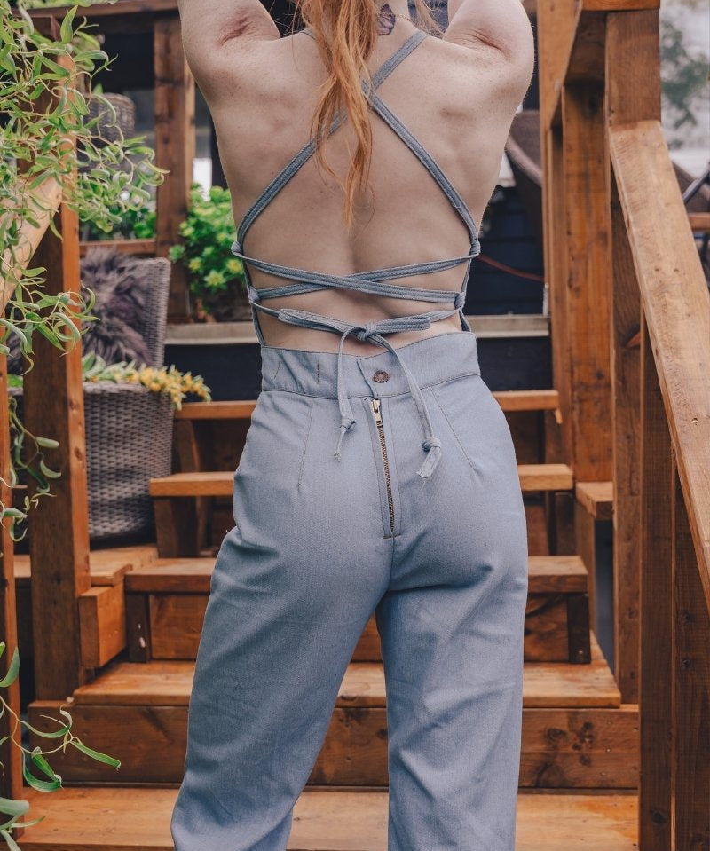  retro 1970s style denim jumpsuit with curved hugging fit and wide flare styled for soulful modern women's fashion