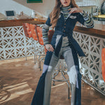 Women walking in a two-tone denim 1970s jumpsuit with flared legs and contrast panel detailing