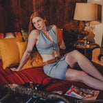 A boho babe wearing wood stock 1970s inspired miniskirt and matching waistcoat 