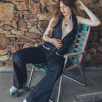 A woman wearing roller skates wears a 70s inspired denim jumpsuit by Soul Sister since 1969