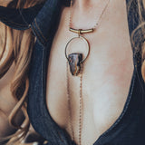 Close-up of the holy halter denim jumpsuit showcasing open back detail stitching and retro structure with oversized collar for soul sister since 1969