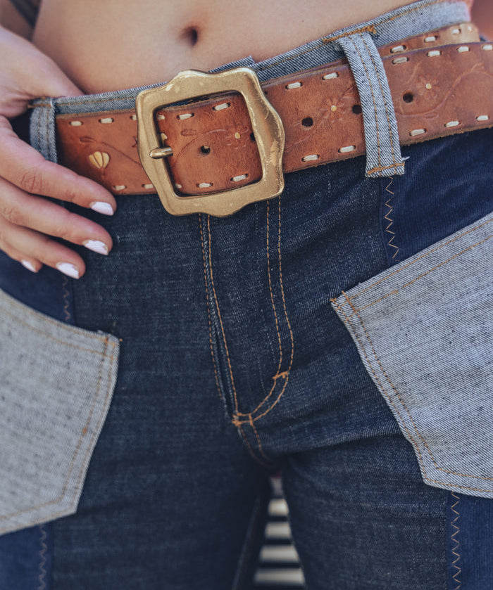 Janice patchwork denim bell bottom jeans in navy, side angle showing the flare