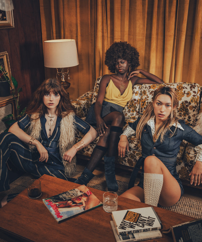 70s inspired romper look styled in a nostalgic living room featuring a classic record player and retro decor