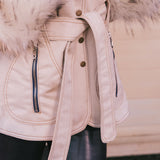 Close-up of a beige Penny lane vintage 70s inspired winter coat with fur  and belt