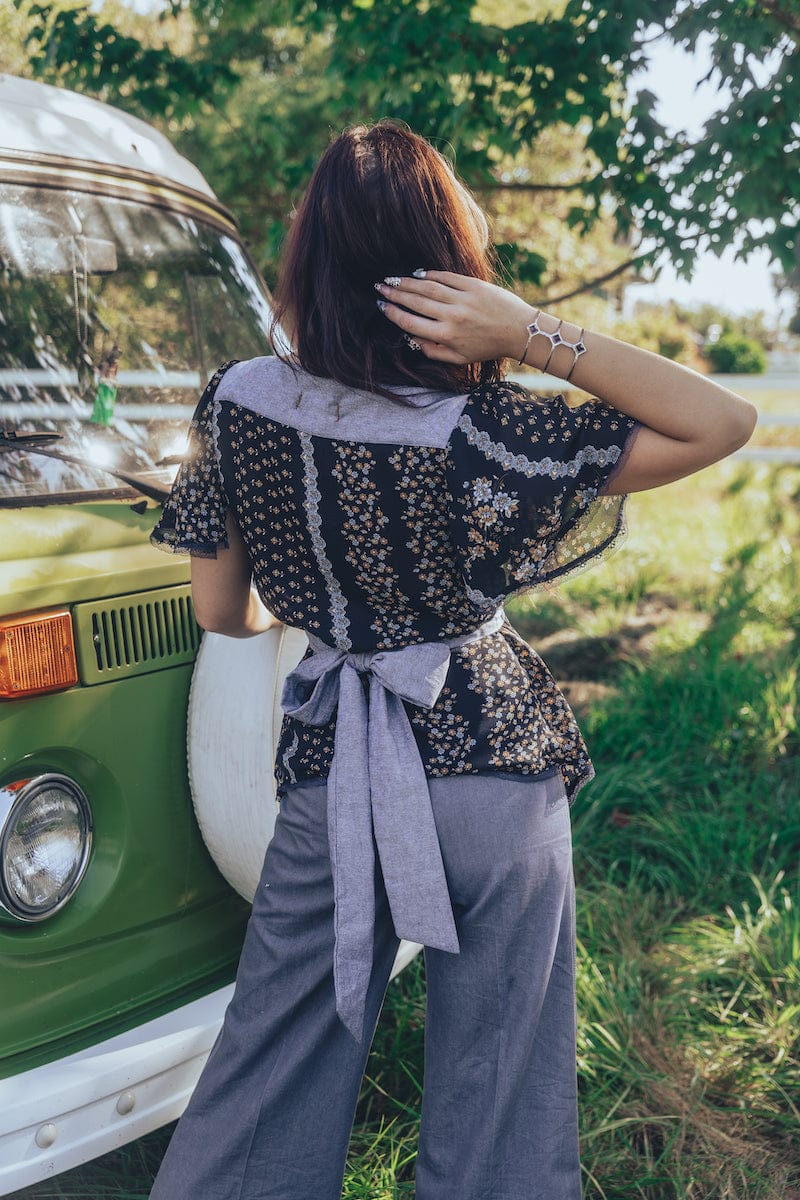 Girl wears floral to with bow at the back