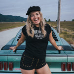 Woman posing on a classic car with a scenic background Ride or Die Motor Club wearing soul sister since 1969
