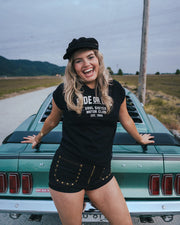 Woman posing on a classic car with a scenic background Ride or Die Motor Club wearing soul sister since 1969
