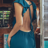 long flowy teal boho maxi dress with open back and ruffle details