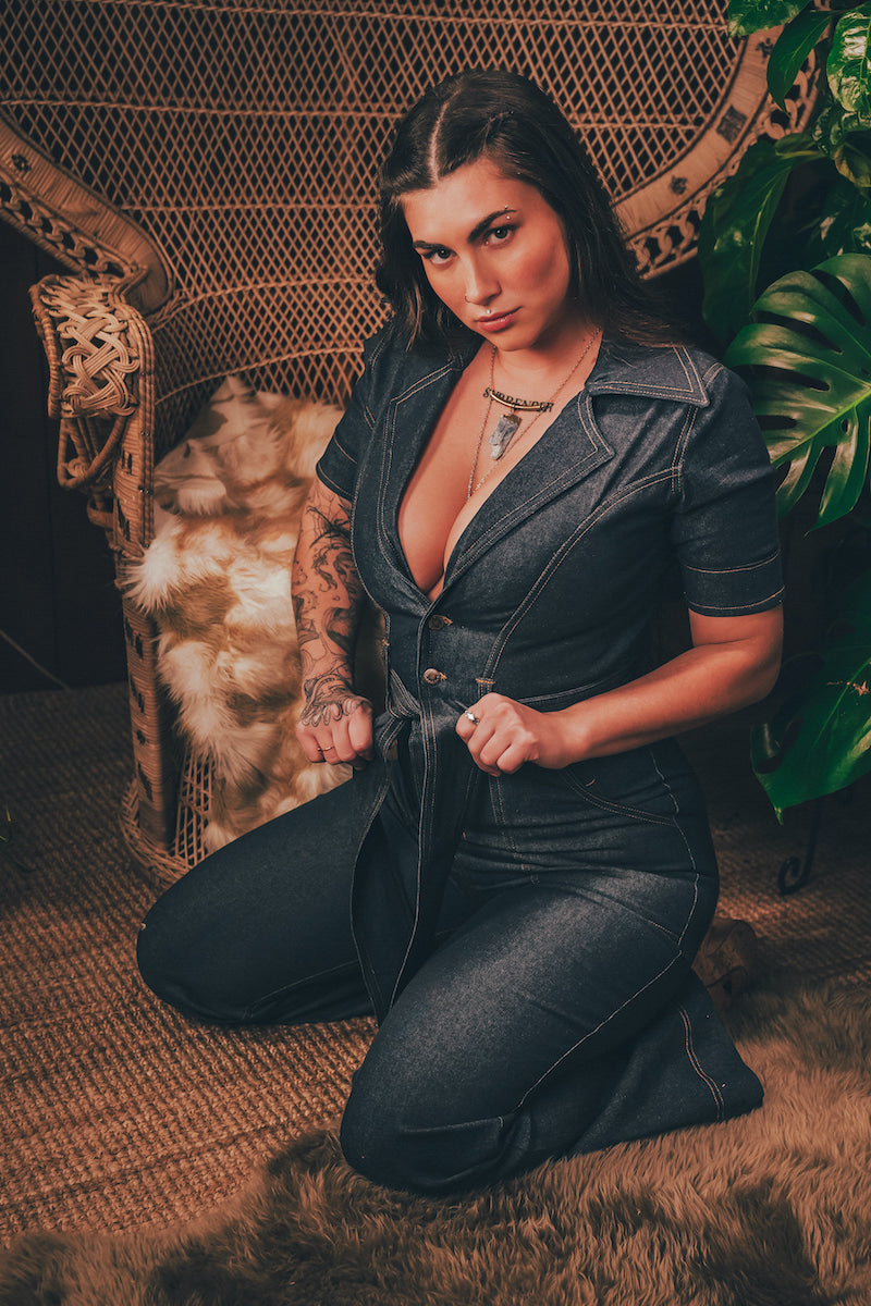 Lola Love stretch denim bell bottom  jumpsuit with belted waist, front pockets, and a bold 70's inspired silhouette for effortless retro cool soul sister since 1969