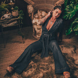 Lola Love stretch denim bell bottom  jumpsuit with belted waist, front pockets, and a bold 70's inspired silhouette for effortless retro cool by soul sister since 1969