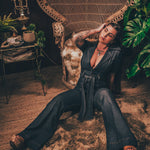 Lola Love stretch denim bell bottom  jumpsuit with belted waist, front pockets, and a bold 70's inspired silhouette for effortless retro cool by soul sister since 1969