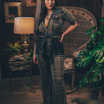 Knit plaid diva jumpsuit with contrasting denim front pockets, collar, and belt, blending retro 70's charm with bold, modern flair.