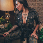 Knit plaid diva jumpsuit with contrasting denim front pockets, collar, and belt, blending retro 70's charm with bold, modern flair.
