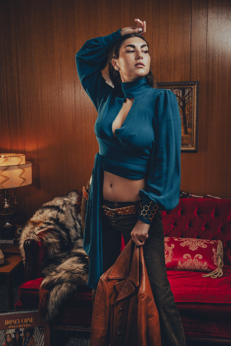 Soul Sister since 1969- Mary Gold Peek backless peek boo blouse teal with wrap detail, turtle neck, and long tulip sleeves, a sophisticated and sexy 70's inspired statement piece