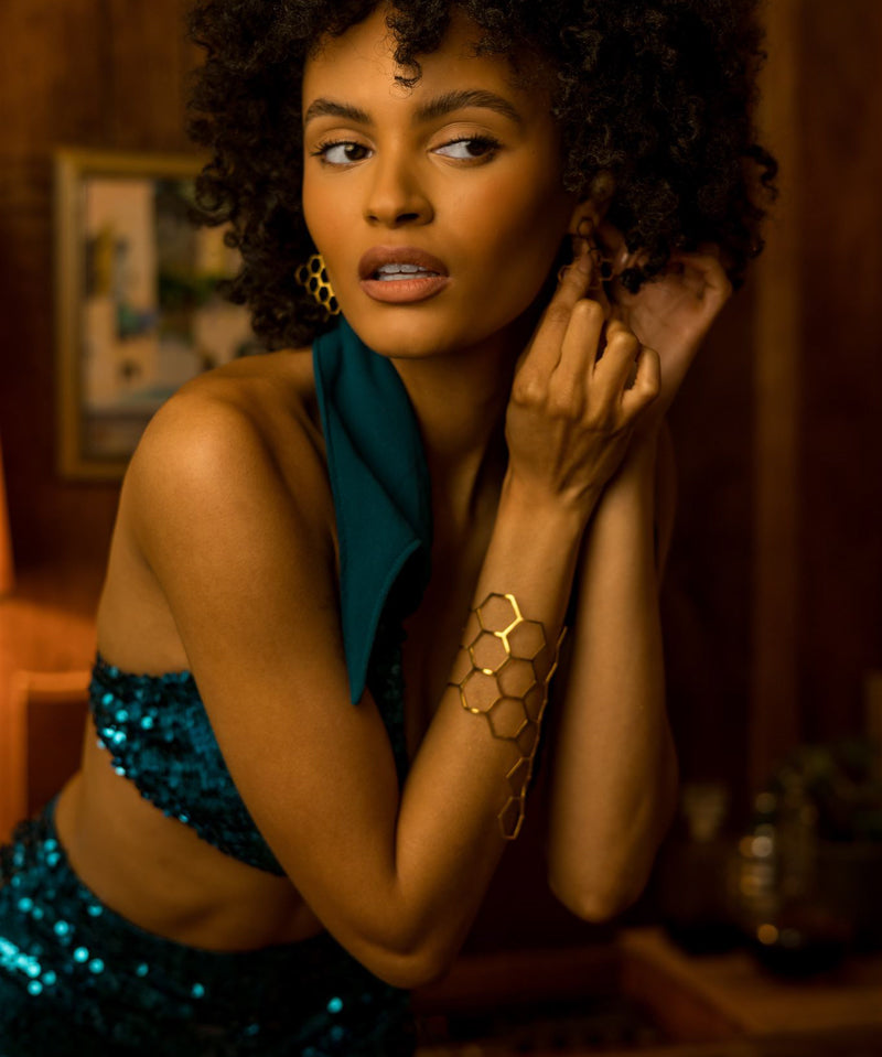 Beauty babe in Soul Sister since 1969 -  beverly sequin shorts putting on earrings