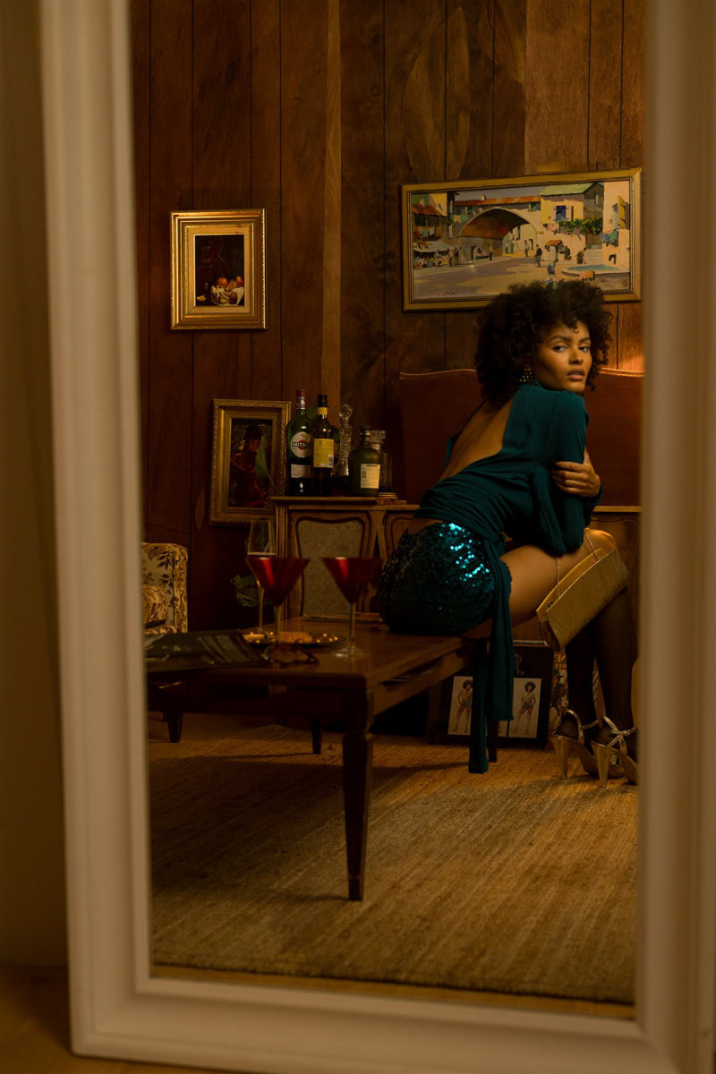 Beauty babe in soul sisters beverly sequin shorts looking into mirror