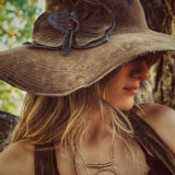 Girl wearing 70's hipie hat
