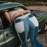 Person leaning out of a car window with a scenic background wearing Soul Sister since 1969.